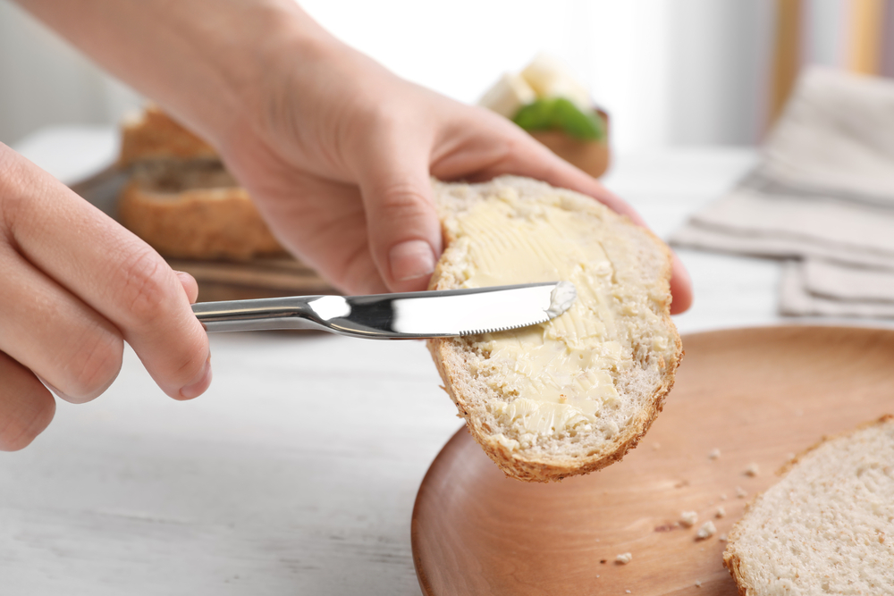 Butter spreading on bread