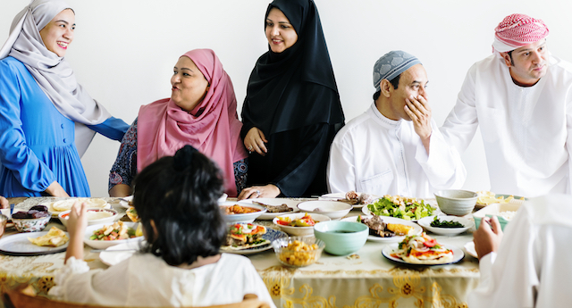 Muslim family celebrating end Ramadan colour
